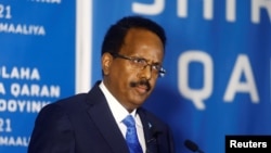 FILE - Somalia's President Mohamed Abdullahi Mohamed addresses delegates at the Somali election negotiation in Mogadishu, May 27, 2021.