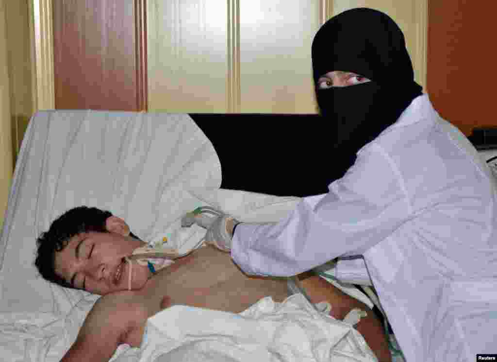 A youth, affected by what activists say is toxic gas, is treated at a hospital near Damascus, August 21, 2013.
