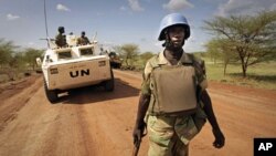 A UN handout picture shows a soldier from Zambia serving with the international peacekeeping operation on patrol in the region of Abyei (File)