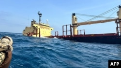 This picture taken on Feb. 27, 2024, shows the Rubymar cargo ship sinking off the coast of Yemen. The Rubymar, carrying combustible fertilizer, was damaged in a missile strike on February 18 claimed by the Iran-backed Houthi rebels.