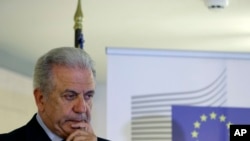 FILE - EU Migration Commissioner Dimitris Avramopoulos, shown at a news conference after a meeting with local officials in Athens on June 12, 2015.