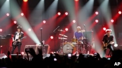 Ron Wood, from left, Charlie Watts, and Keith Richards of The Rolling Stones performing at the 12-12-12 The Concert for Sandy Relief at Madison Square Garden in New York, December 12, 2012.