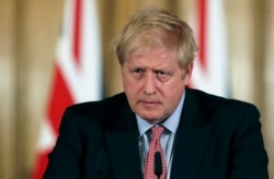 Britain's Prime Minister Boris Johnson holds a news conference to give the government's response to the COVID-19 coronavirus outbreak, at Downing Street in London, March 12, 2020.