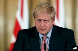 Britain's Prime Minister Boris Johnson holds a news conference to give the government's response to the COVID-19 coronavirus outbreak, at Downing Street in London, March 12, 2020.