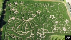 This July 19, 2024 image released by Downey's Farm in Caledon, Ontario shows a corn maze honoring the 75th anniversary of the Peanuts comic strip. (Joanne Strom/Downey's Farm via AP)