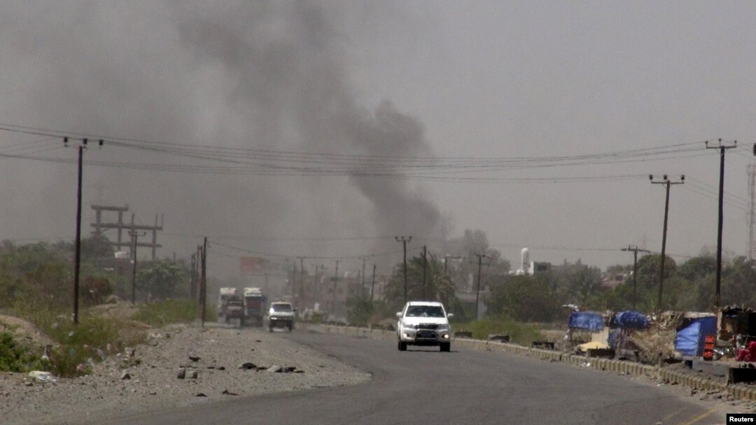 FILE - Smoke rises from a government building in al-Houta, the provincial capital of Yemen's southern Lahej province, March 21, 2015. Officials say the city is now back under government control after troops trained by the Saudi-led coalition routed al-Qaida militants.