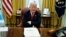FILE - President Donald Trump speaks with reporters in the Oval Office of the White House in Washington. 