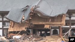 The Tozen-ji shrine building is one of the few in town still standing, Natori, Japan, March 21, 2011