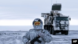 FIEL - A Russian solder stands guard as Pansyr-S1 air defense system on the Kotelny Island, part of the New Siberian Islands archipelago located between the Laptev Sea and the East Siberian Sea, April 3, 2019.