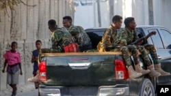 FILE - Somalia police patrol near the scene of a suicide bomber attack at a cafe, in Mogadishu, Somalia, Oct. 17, 2024. Somali leaders are “ready to reconsider” Ethiopian military support in the country after talks held in Turkey on Dec. 11, 2024.