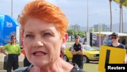 FILE - Australian Senator Pauline Hanson talks with members of the media in Townsville, Queensland, Australia, Nov. 10, 2017.