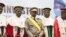 New interim Malian President, Colonel Assimi Goita, center, stands with members of the Supreme Court during his swearing in ceremony in Bamako on June 7, 2021.