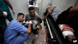 Palestinians wounded in the Israeli bombardment of the Gaza Strip receive treatment at Nasser Hospital in Khan Younis, in the southern Gaza Strip, Jan. 22, 2024.