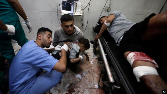 Palestinians wounded in the Israeli bombardment of the Gaza Strip receive treatment at Nasser Hospital in Khan Younis, in the southern Gaza Strip, Jan. 22, 2024.