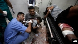 Palestinians wounded in the Israeli bombardment of the Gaza Strip receive treatment at the Nasser hospital in Khan Younis, Southern Gaza Strip, Jan. 22, 2024. 