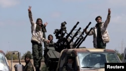 Libyan National Army (LNA) members, commanded by Khalifa Haftar, head out of Benghazi to reinforce the troops advancing to Tripoli, in Benghazi, Libya, Apr. 7, 2019. 