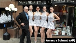 What is one of the beautiful English words? (The Radio City Rockettes are standing in front of a clue!)