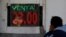 A man reacts as he looks at a board displaying the exchange rate of Mexican peso against the US dollar at a foreign exchange house in Ciudad Juarez, Mexico, Jan. 20, 2017.