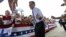 Republican presidential candidate, former Massachusetts Gov. Mitt Romney gestures as he greets supporters as he arrives at a Florida campaign rally at Orlando Sanford International Airport, in Sanford, Fla., Nov. 5, 2012. 