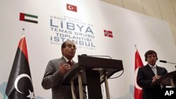 Libyan rebel leader and senior member of Libya's National Transitional Council (NTC) Mahmoud Jibril, speaks during a joint news conference with Turkey's FM Ahmet Davutoglu (R) in Istanbul, August 26, 2011