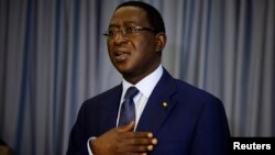 Defeated presidential candidate Soumaila Cisse sings his political party's anthem during a news conference in Bamako, Mali, Aug. 13, 2013.