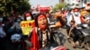 Anti-coup protesters join a rally on motorcycles in Mandalay, Myanmar, Feb. 13, 2021. 