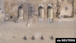 What appears to be damage from Iranian missiles at Al Asad air base in Iraq is seen in a satellite picture taken Jan. 8, 2020. The base houses U.S. military personnel.
