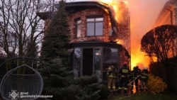 Firefighters work at the site of a Russian missile strike in Dnipro, Ukraine, Nov. 21, 2024. (Press service of the State Emergency Service of Ukraine in Dnipropetrovsk region/Handout via REUTERS)