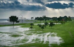 The sky is cloudy over Lake Pontchartrain on Lakeshore Drive as little flooding is reported in New Orleans, ahead of Tropical Storm Barry making landfall, July 13, 2019.