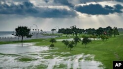 The sky is cloudy as over Lake Pontchartrain on Lakeshore Drive as little flooding is reported in New Orleans, ahead of hurricane Barry making landfall on Saturday, July 13, 2019.