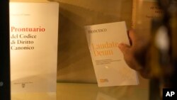 FILE - Copies of Pope Francis' latest encyclical letter on environment "Laudate Deum" are seen in a bookshop in Rome, October 4, 2023.