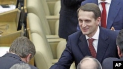 Deputies of the United Russia party congratulate Sergei Naryshkin (R), newly elected speaker of Russia's State Duma, during the first session of the lower house of parliament in Moscow, December 21, 2011.