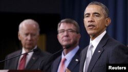 FILE - U.S. President Barack Obama delivers remarks after a National Security Council meeting on the counter-Islamic State campaign, accompanied by U.S. Vice President Joe Biden (L) and U.S. Defense Secretary Ash Carter (C) in Washington on Dec. 14, 2015.