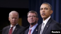 U.S. President Barack Obama delivers remarks after attending a National Security Council meeting on the counter-Islamic State campaign accompanied by U.S. Vice President Joe Biden (L) and U.S. Defense Secretary Ash Carter (C) at the Pentagon in Washington