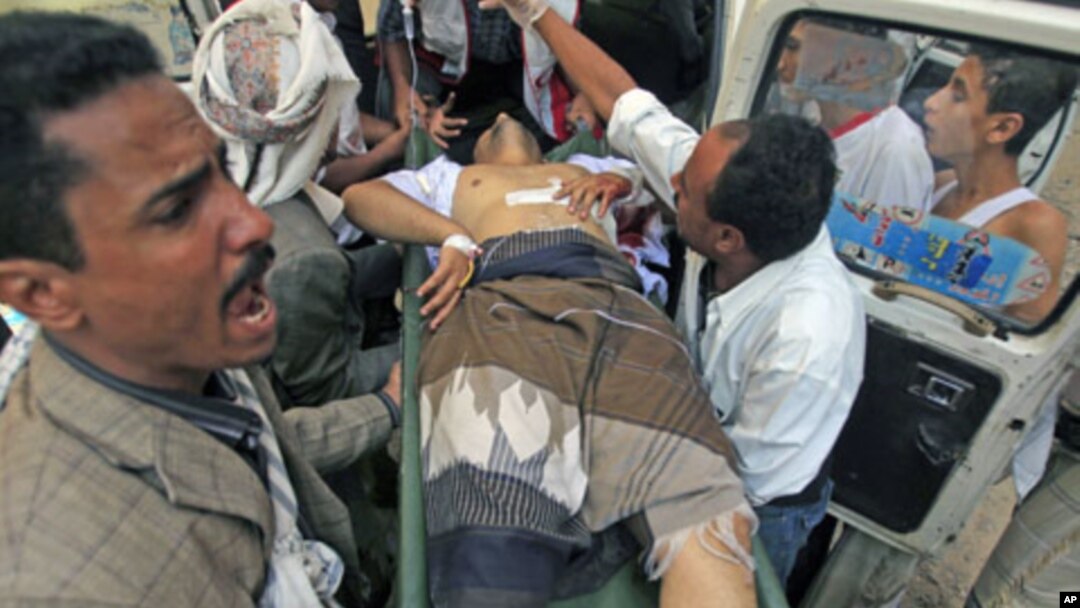 An injured opposition fighter rushed to a hospital after clashes with government security forces in the southern city of Taiz, Yemen, November 2, 2011.