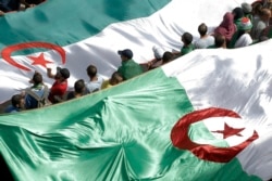 FILE - Algerian protesters gather during an anti-government demonstration in the center of the capital Algiers, Algeria, June 14, 2019.