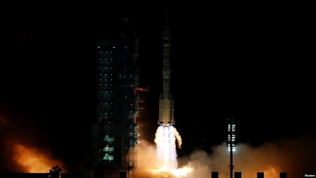 The Long March-2F Y13 rocket, carrying the Shenzhou-13 spacecraft and three astronauts in China's second crewed mission to build its own space station, launches at Jiuquan Satellite Launch Center near Jiuquan, Gansu province, Oct. 16, 2021. 