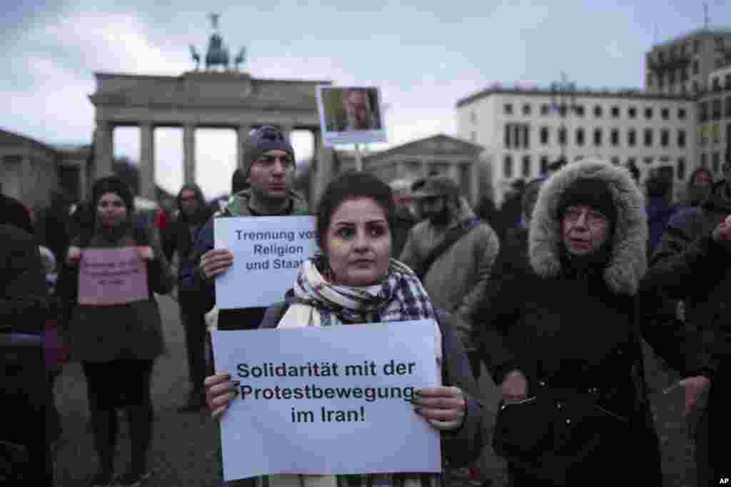 Demonstrators protest against the current government in Iran in front of the Brandenburg Gate in Berlin, Jan. 2, 2018.