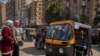 Toktoks are waiting for passengers at the subway station of Sayeda Zaynab in old Cairo. (H. Elrasam/VOA)