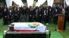 Former Peruvian President Alberto Fujimori's son Kenji, right, speaks during his father's burial at the Campo Fe cemetery in Huachipa in eastern Lima, Sept. 14, 2024.