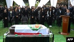 Former Peruvian President Alberto Fujimori's son Kenji, right, speaks during his father's burial at the Campo Fe cemetery in Huachipa in eastern Lima, Sept. 14, 2024.