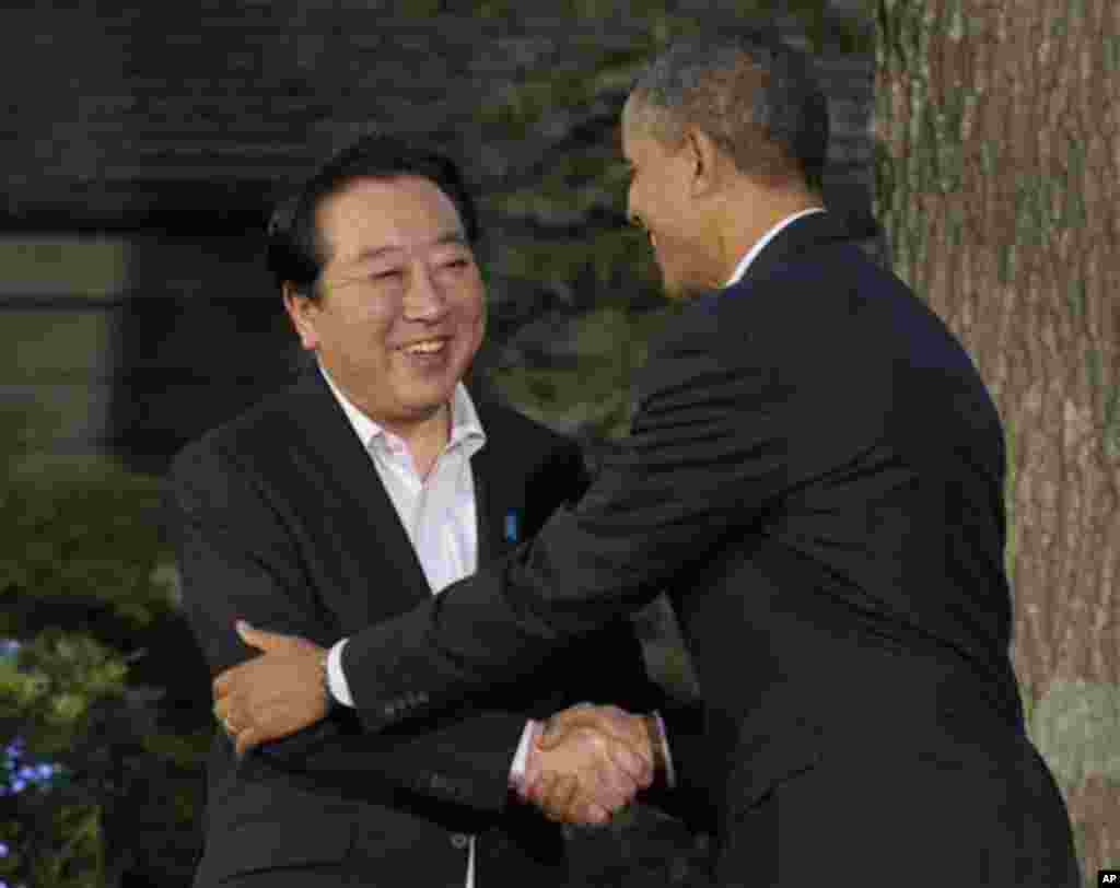 President Barack Obama, right, greets Japan's Prime Minister Yoshihiko Noda on arrival for the G8 Summit Friday, May 18, 2012 at Camp David, Md. (AP Photo/Charles Dharapak)