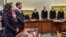 Suspect Beate Zschaepe (L) stands beside her lawyer Mathias Grasel (2nd-L) before Presiding Judge Manfred Goetzl, second from right, speaks the verdict in the court in Munich, southern Germany, July 11, 2018. 