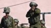 اسرائیلی فوجی جنوبی قصبے سیٹروٹ کے قریب گشت کے دوران۔ 15 اکتوبر 2023