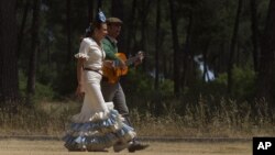 FILE - A couple is seen in the countryside of Almonte in Huelva province, Andalusia, Spain.