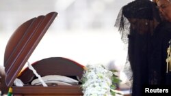 FILE: Former first lady of Zimbabwe, Grace Mugabe pays her last respects during a state funeral of her husband and Zimbabwe's longtime ruler Robert Mugabe, at the national sports stadium in Harare, Sept. 14, 2019. 