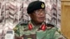 Zimbabwe's Army Commander, Constantino Chiwenga addresses a press conference in Harare, Monday, Nov. 13, 2017. The army commander Monday criticized the instability in the country’s ruling party caused by President Robert Mugabe who last week fired a vice president. (AP Photo/Tsvangirayi Mukwazhi)