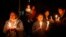 Exile Tibetans participate in a candle light vigil in solidarity with fellow Tibetans who have self immolated, in Katmandu, Nepal, February 13, 2013.