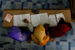 FILE - Rohingya Muslim children recite from the holy Quran at a school in Klang, on the outskirts of Kuala Lumpur, Malaysia, Sept. 12, 2017.