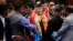 FILE - Nepal’s prime minister, Khadga Prasad Oli, center, speaks with members of his cabinet inside the Constituent Assembly in Kathmandu, Nepal, Oct. 11, 2015.